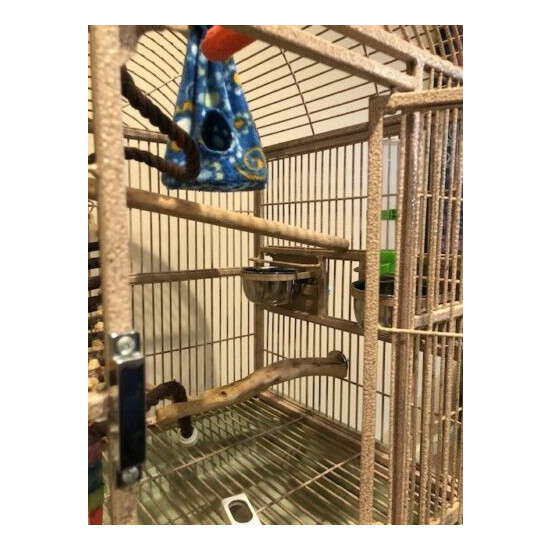 Bird cage with stand. Overall 18 x 24 x 53 dome top beige. Includes toys shown image {2}
